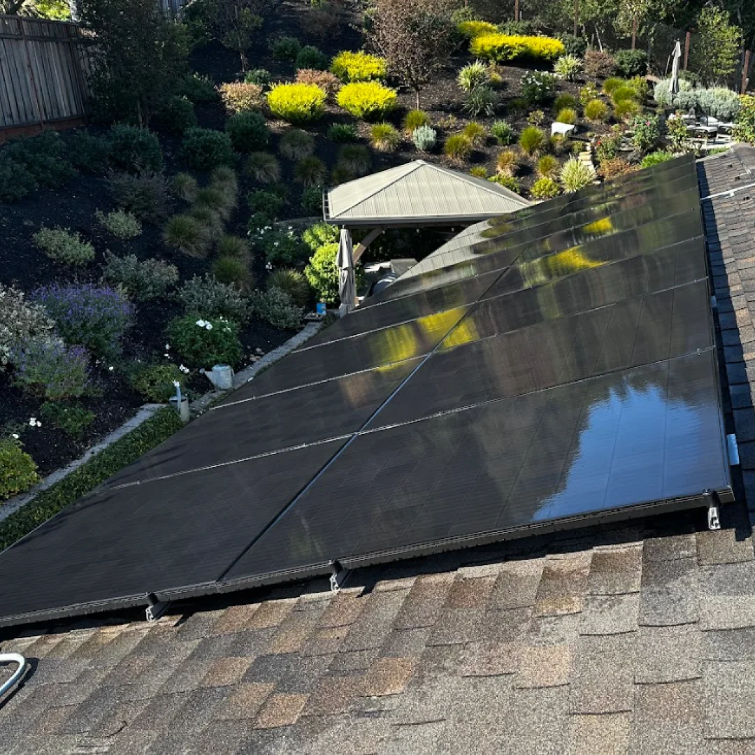 Aerial view of clean solar panels on Danville residence after professional cleaning service